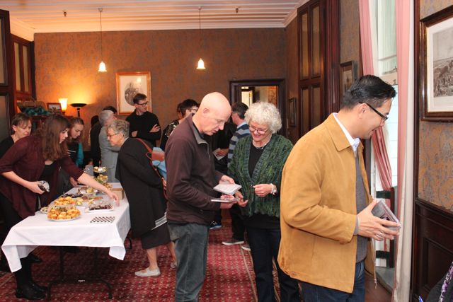 Guests inspecting CDs and afternoon tea
