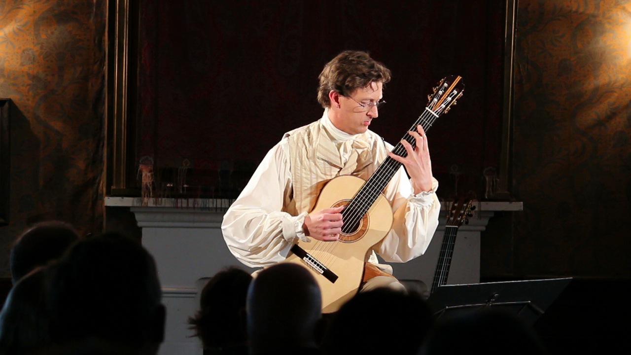 Bruce Paine classical guitarist in performance